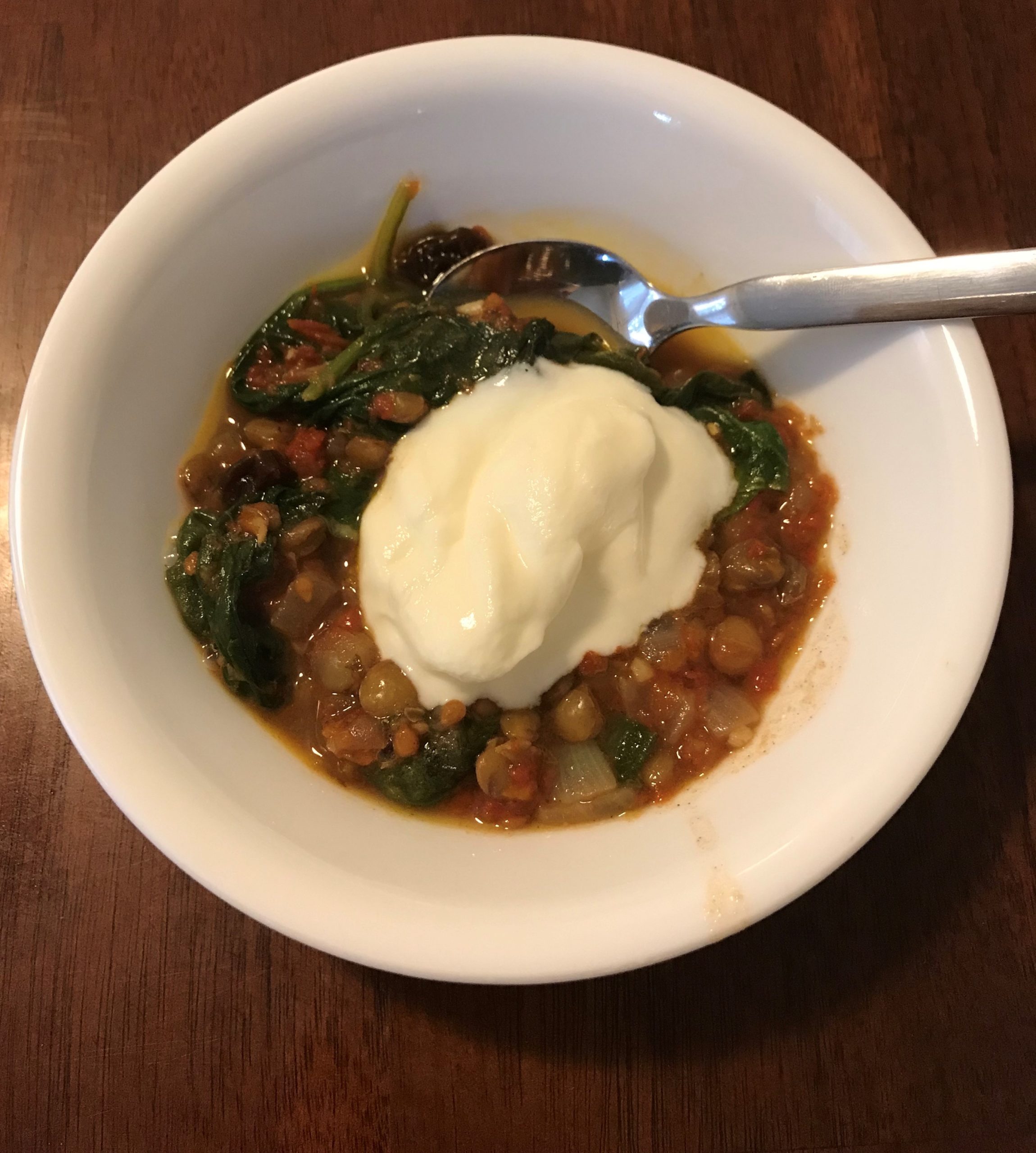 vegetarian Indian lentil soup with spinach and tomatoes